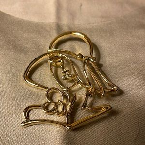 Gold colored lady with hat pin. Vintage look